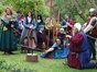 re-enactment group of men and women dressed in medieval and Tudor costumes