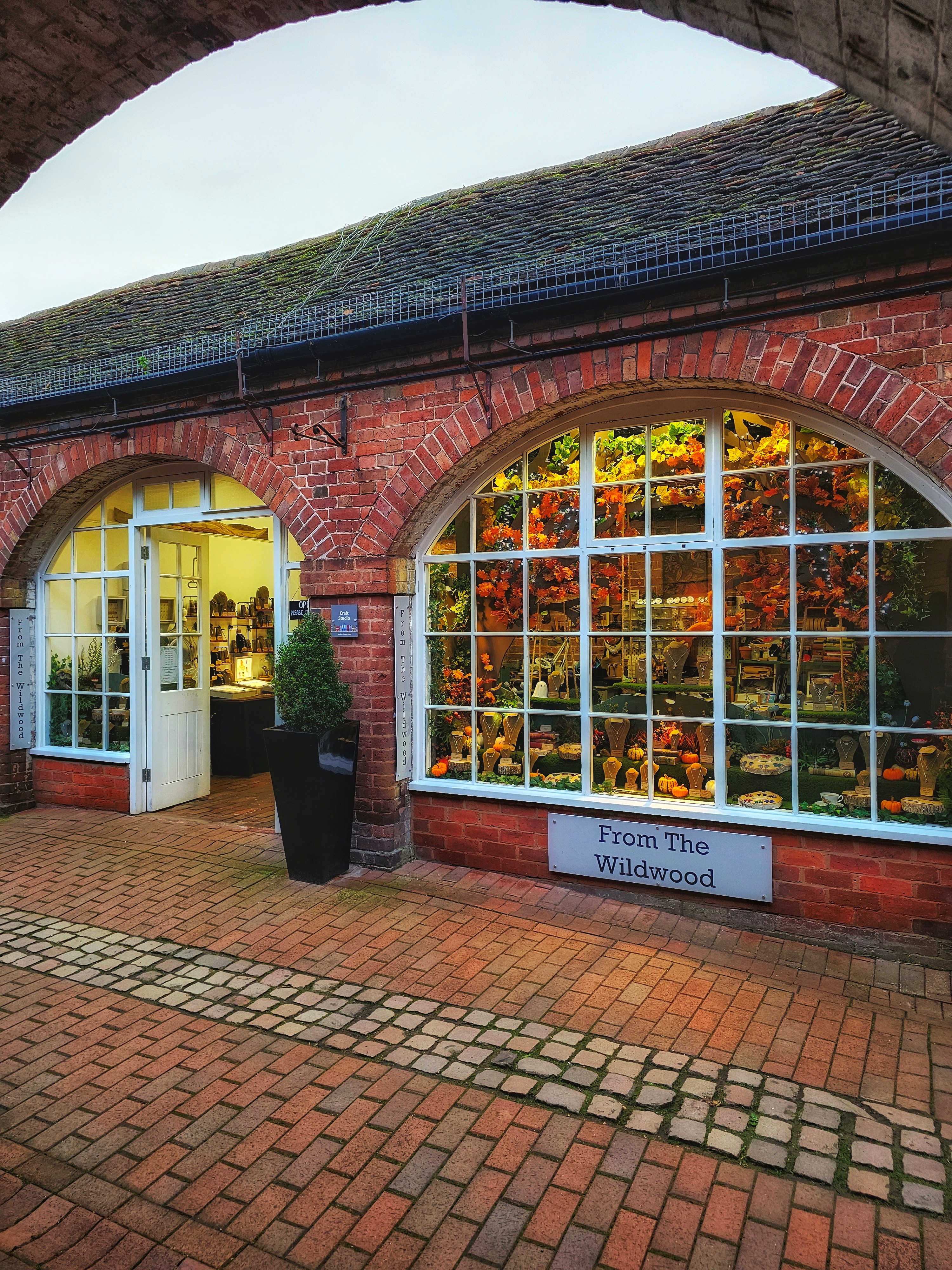 view of front of shop on a cobbled walkway