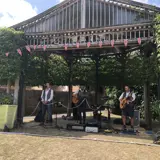 band members stood together in the outdoor theatre