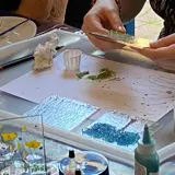 a person doing glass fusing doing a workshop