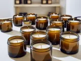 multiple glass jar candles on a table