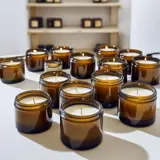 multiple glass jar candles on a table